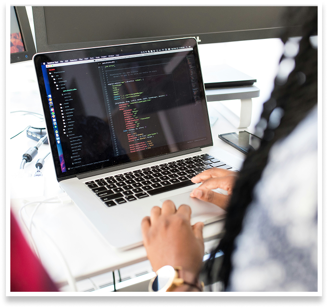 woman coding on laptop